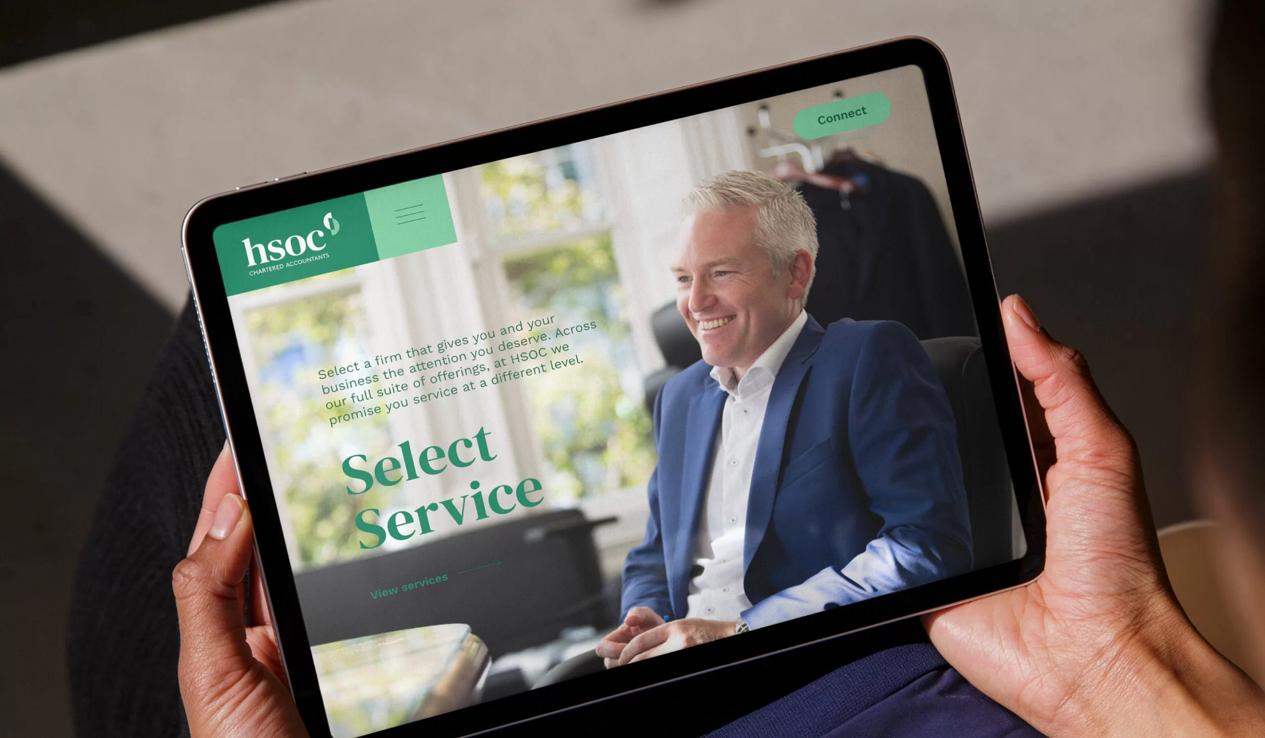 landscape tablet with HSOC website homepage on the screen