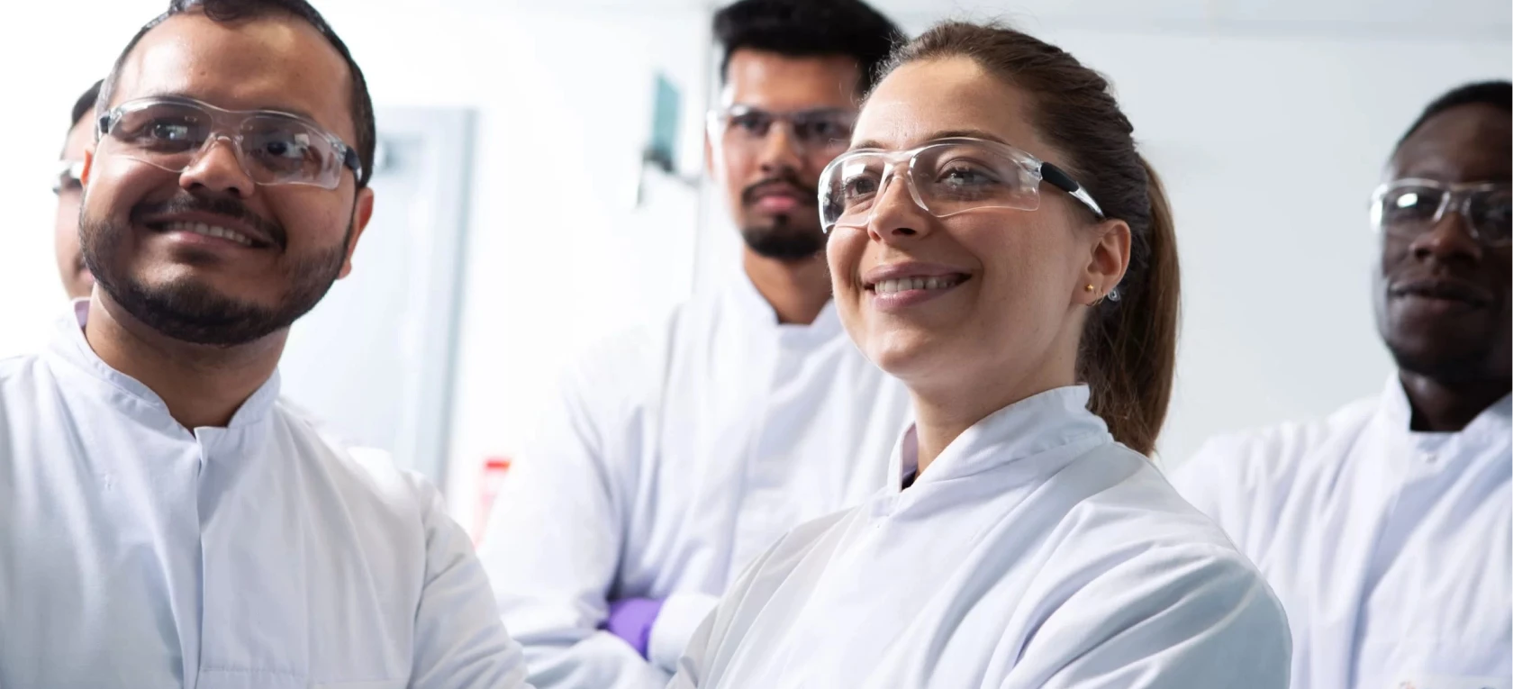 Lab technicians in a smilling group