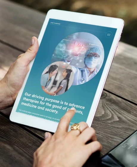 Close-up of an ipad being held in the hands of a man
