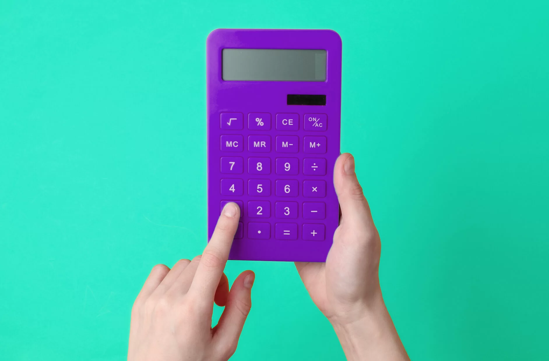 2 hands on a calculator